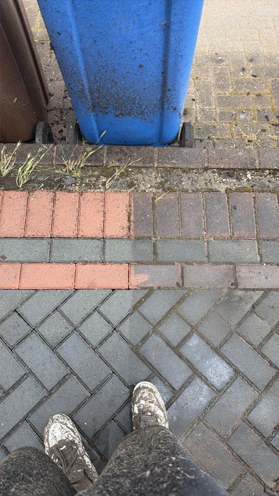 Before and after pressure washing: a single surface cleaned, showing the dramatic difference